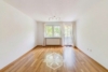 Freundliche 1,5-Zimmer-Wohnung mit TG-Stellplatz und Balkon - Wohnzimmer